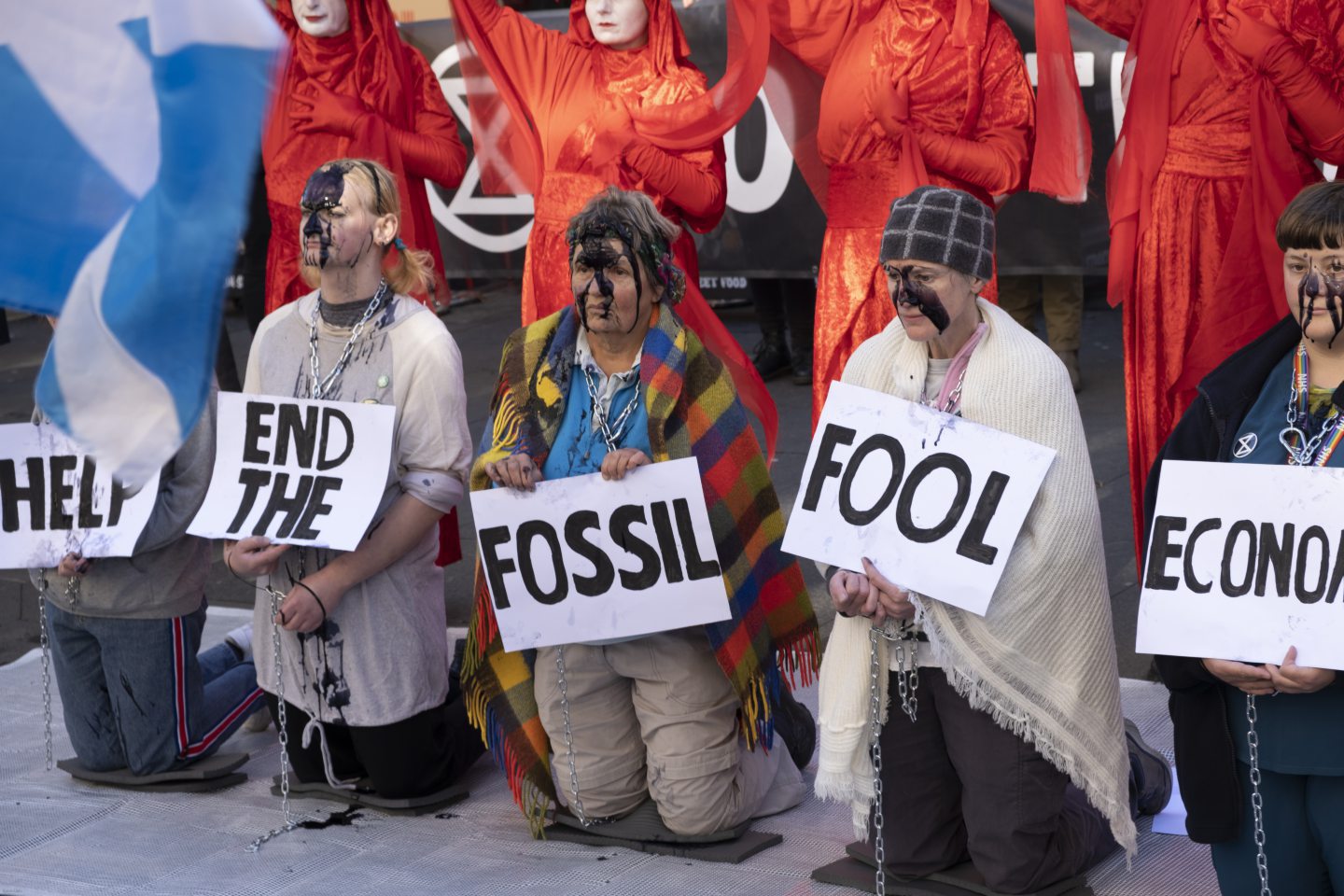Illustration of protesters in France holding signs and chanting during a demonstration